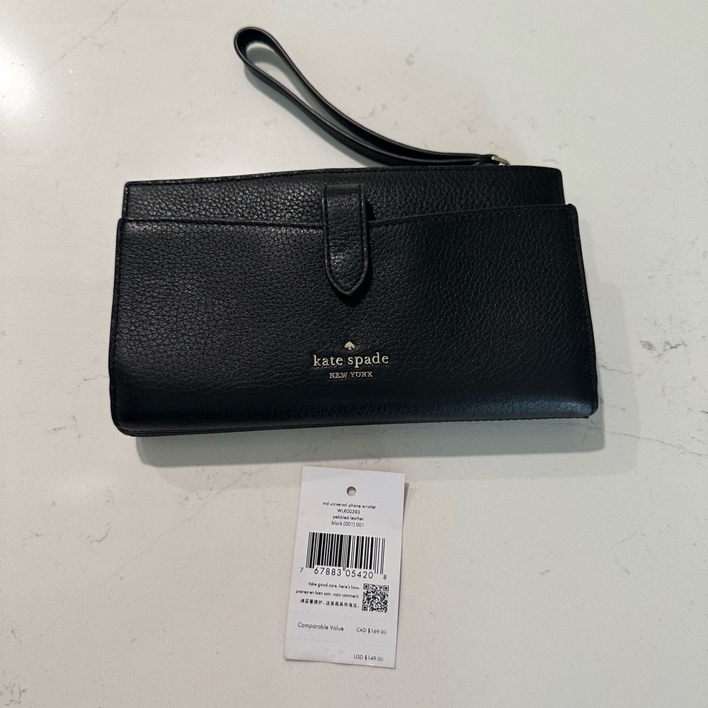 Authentic pre-loved Kate Spade universal phone wristlet in pebbled black.